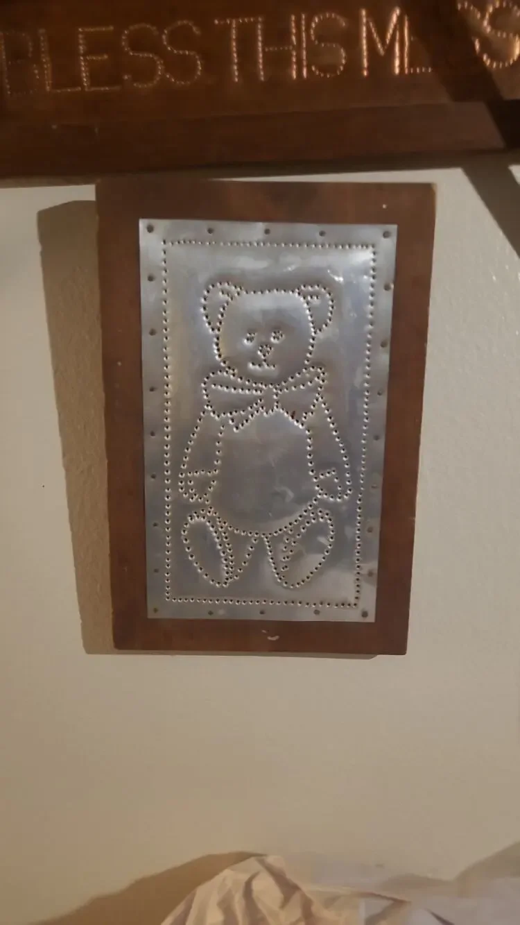 hand-punched tin teddy bear On Wood Plaque